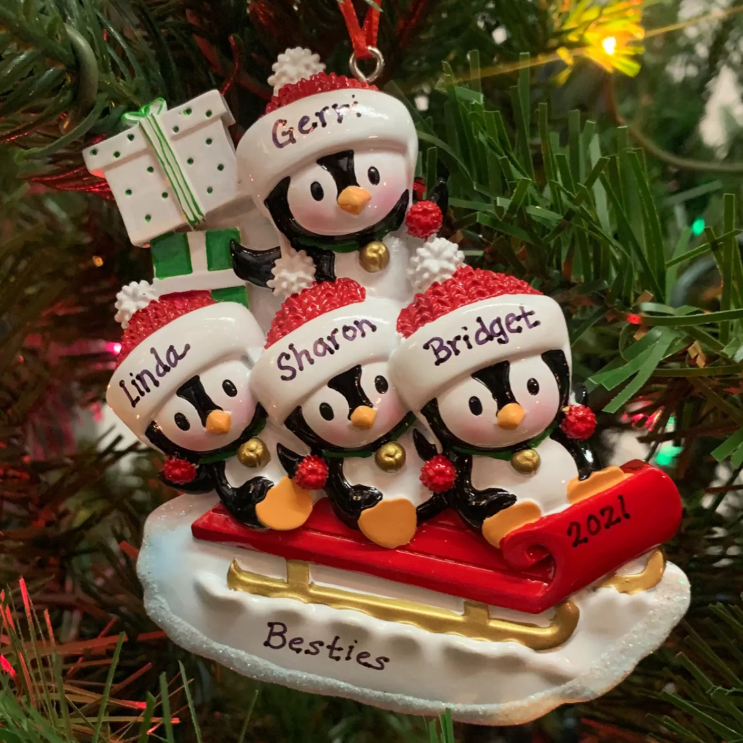 The Jolly Christmas Shop Personalized Ornaments·Family Ornaments | Animals·Birds | 4.25" Family Of 4 Penguins On Sled Personalized Christmas Ornament OR1915-4