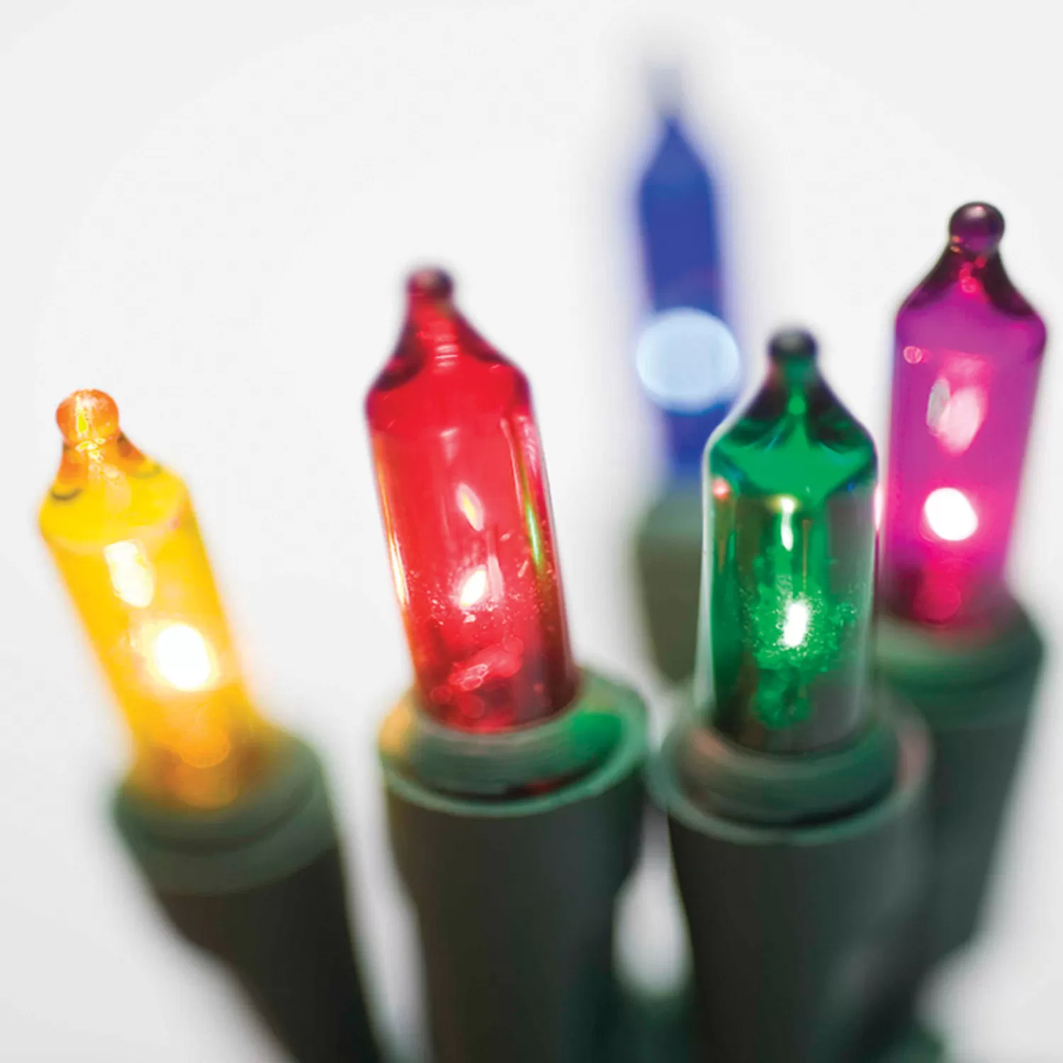 The Jolly Christmas Shop Mini Bulb Lights | Incandescent Lights | Brite Star 25' 100 LT Random Twinkling Multicolor Mini Incandescent Lights On Green 37-490-00